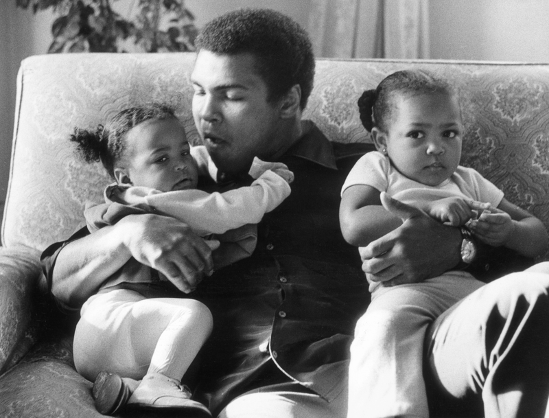 19th December 1978: Heavyweight boxer Muhammad Ali with his daughters Laila (9 months) and Hanna (2 years 5 months) at Grosvenor House. Frank Tewkesbury/Evening Standard/Getty Images